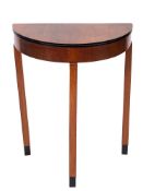 A walnut and ebonised demi-lune side table in Art Deco taste, circa 1930,