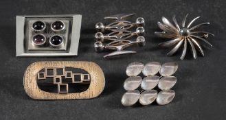Five modernist brooches,: including a silver and synthetic white spinel Kultasepät Salovaara, Turku,