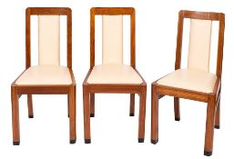 A set of six walnut and faux leather upholstered dining chairs in Art Deco taste,