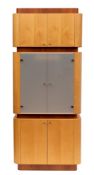 A pair of maple and cherrywood veneered and glazed armoires, modern,: each in three sections,