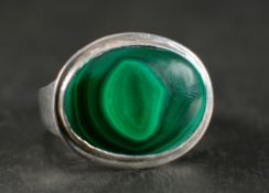 John Sinclair Perkins, a silver malachite ring,: with hallmarks for London, 1996, ring size P 1/2,
