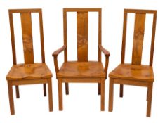 Stewart Linford of High Wycombe, an oak dining table and eight chairs en suite,