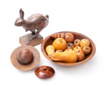 A contemporary carved wood model of a running hare: mounted on a rectangular base,