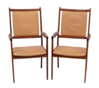 WITHDRAWN A pair of Scandinavian rosewood open armchairs: the cream rexine