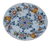 A Bristol polychrome delftware dish: painted in blue, green,