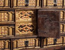 A Spanish polychrome painted and parcel gilt vargueno on stand, in 16th century style,