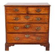 A George III mahogany chest of drawers, circa 1770,: the top with ogee moulded edges,