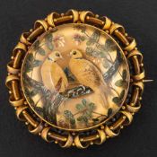 A Victorian, gold, Essex crystal locket brooch/ pendant,: depicting a pair of turtle doves,
