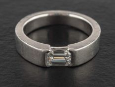 A platinum octagonal, step-cut diamond ring,: estimated diamond weight ca. 0.