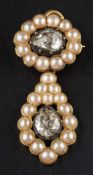 A 19th century drop pendant/ brooch set with two pear-shaped, rose-cut diamonds,
