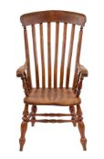 An oak, elm and beech lath back elbow chair in early 19th century style,