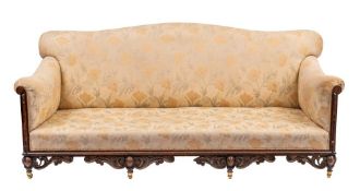 A Victorian carved oak and upholstered sofa, late 19th century,: with camel back,