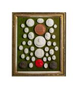 A framed group of Grand Tour style plaster cameos: various subjects including Roman Emperors,
