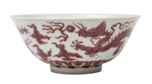 A Chinese copper-red dragon bowl: the first with flared rim,