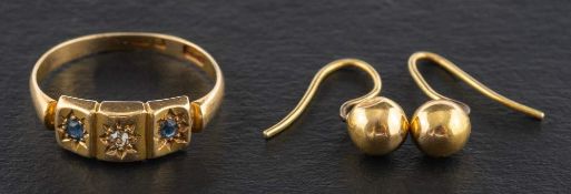An 18ct gold sapphire and diamond three stone ring and a pair of globular earrings,