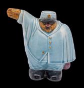A Sarreguemines majolica novelty money box: modelled as a French traffic policeman,