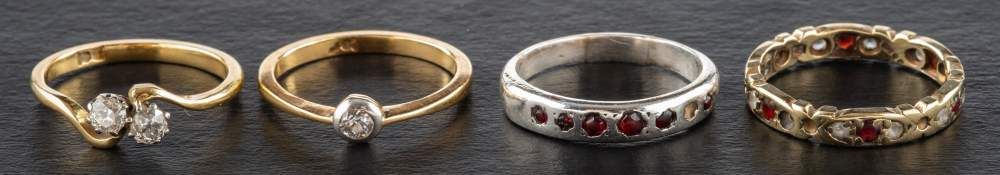 Four rings,: including a two stone, old-cut diamond cross-over ring,