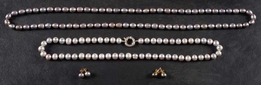 Two cultured pearl necklaces and associated pairs of earrings,
