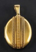 A Victorian, oval locket with cannetille decoration,: total length ca. 5.5cm, total weight ca. 17.