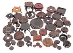 A collection of Chinese carved hardwood and other stands: Qing dynasty and later,
