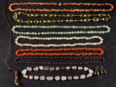 A collection of eight bead necklaces,: including rose quartz, agate, carnelian, coral,