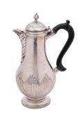 A Victorian silver coffee pot, maker Hawksworth, Eyre & Co, Sheffield, 1879: crested,
