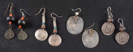 Four pairs of bead drop earrings with applied, abstract patterns,