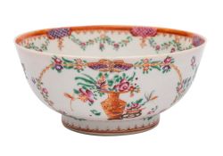 A Chinese export famille rose slop bowl: painted with vases of flowers,