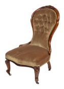A Victorian carved walnut and upholstered chair, circa 1865,
