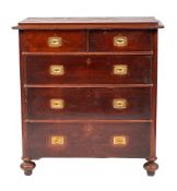 A walnut veneered chest of drawers in Campaign style, circa 1925,