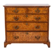 A George II walnut, feather and crossbanded chest of drawers, mid 18th century,