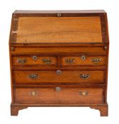 A George II oak and mahogany banded bureau, mid 18th century,