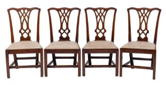 A set of four George III mahogany 'provincal Chipperdale' dining chairs, late 18th century,