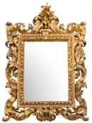 A 19th Century Italianate carved giltwood wall mirror:, of large size,