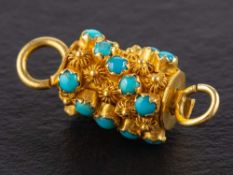 A barrel-shaped clasp,: set with cabochon-cut turquoises and cannetillework, length ca. 2.