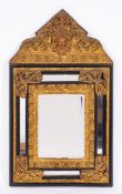A Dutch ebonised wood and gilt repousse metal mounted wall mirror in 17th century style,