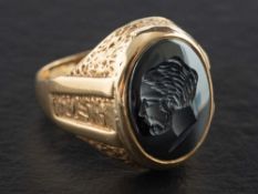 A 9ct gold, hematite signet ring,: depicting profile of a gentleman, with hallmarks for Birmingham,