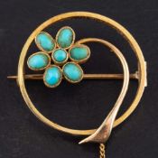 A circular, openwork, turquoise brooch, of stylised flower design,: stamped '9ct', diameter ca. 2.