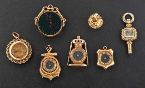 Six fobs and a watch key,: a 9ct gold carnelian and jasper fob, hallmarks for Birmingham,