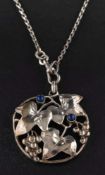 A Jugenstil, lapis lazuli, pendant,: depicting vine leaves and bunches of grapes, stamped '800',