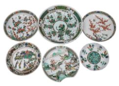A group of six Chinese famille verte dishes and chargers, Kangxi: variously painted with figures,
