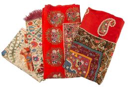 An Indo-Persian wall hanging: the central field with trailing foliage and flowerheads enclosed by a