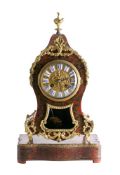 A French boulle mantel clock and stand: the eight-day duration movement striking the hours and