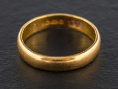 A 22ct gold band ring,: with hallmarks for Birmingham, ring size N1/2, total weight ca. 4.2gms.