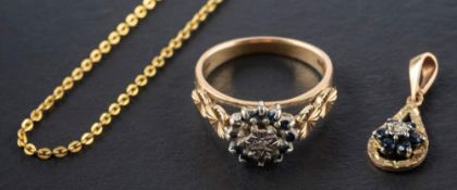 A 9ct gold sapphire and diamond cluster pendant ring,: with hallmarks for Birmingham, 1979,