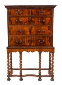 A George II walnut and feather banded chest on stand, second quarter 18th century and later,