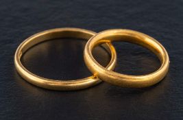 Two 22ct gold band rings,: one with hallmarks for Birmingham, 1937,