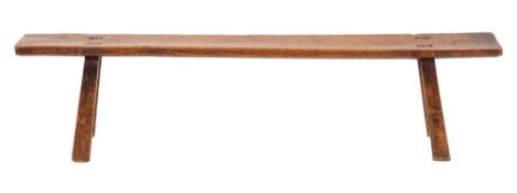 An ash and oak pig bench, late 18th / early 19th century,: the seat on four splayed,