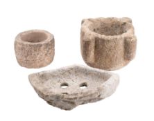 A stone water stoop: of semi-circular outline with four draining holes, 30cm wide,