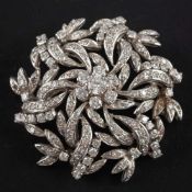 A floral, openwork, single and round, brilliant-cut diamond brooch,